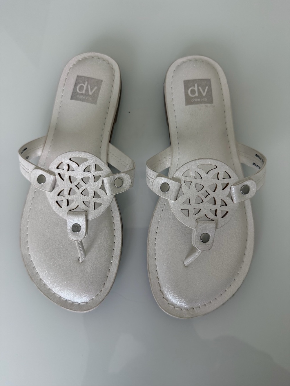 DV by Dolce Vita White Metallic Cutout Medallion Thong Sandals